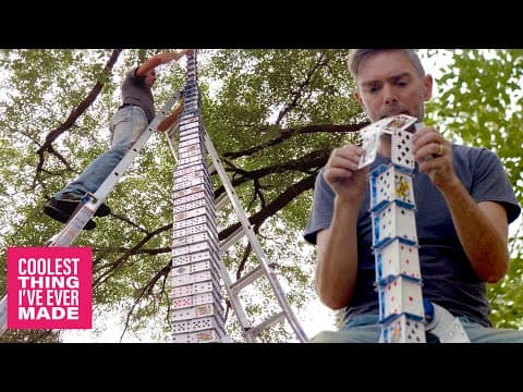 Card stacker Bryan Berg builds a card tower outside