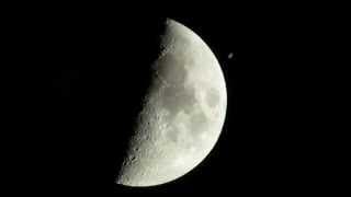 The International Space Station (ISS) crosses (transit) the moon